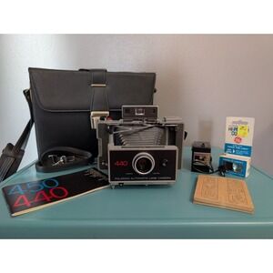 Vintage Polaroid 440 Automatic Land Camera with Strap, Case, Film, and Xtra Bulb